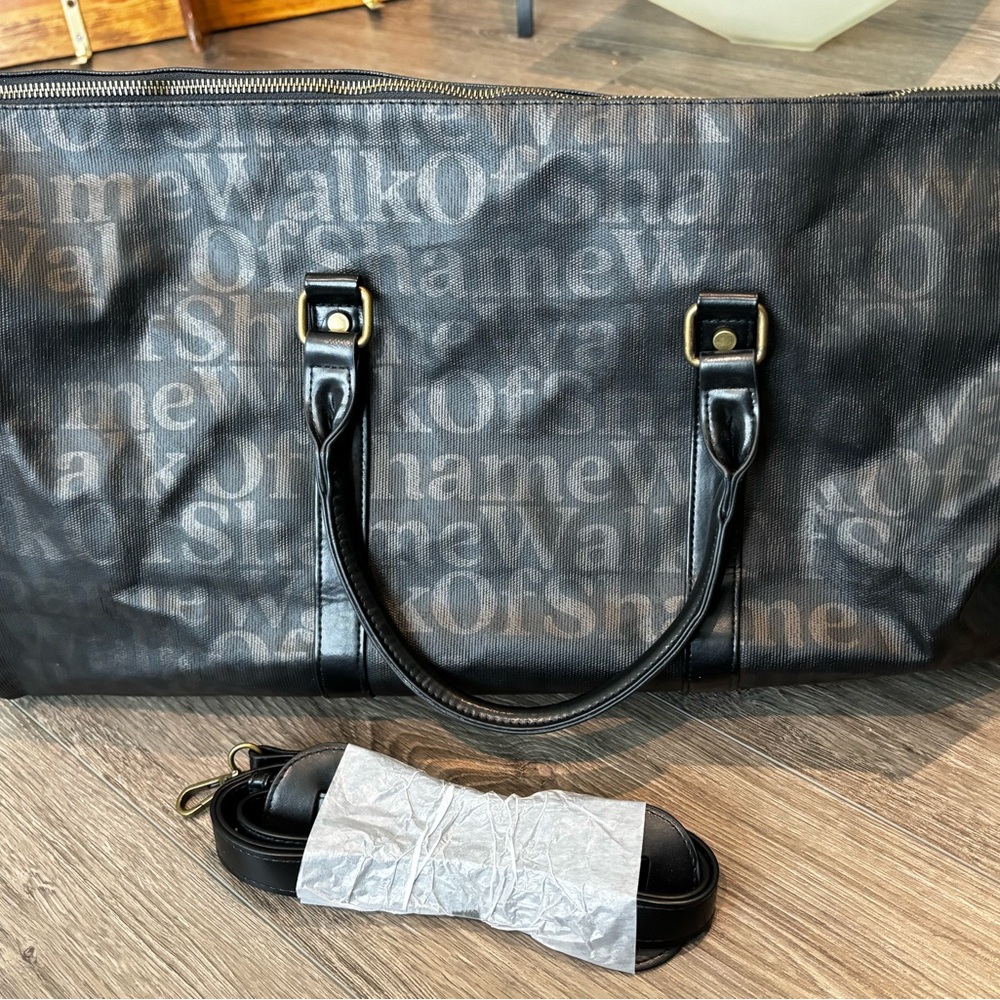 Walk Of Shame Black Duffle Bag Adjustable Strap Pink Interior Text Pattern